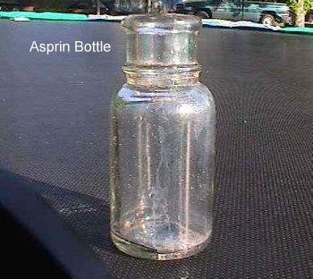 Probably a medicine bottle. There are not any markings.